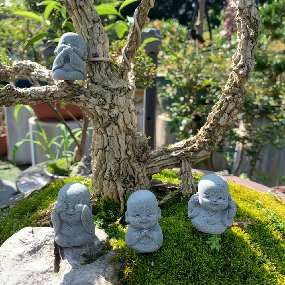 Set of Four Gray Buddha Figurines